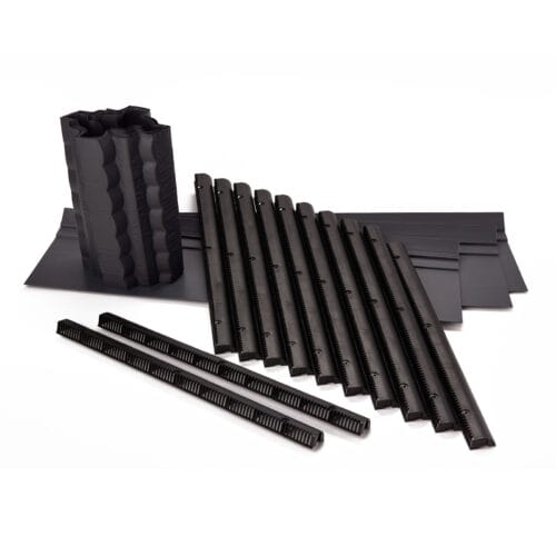 EasyTrim 3‑in‑1 eaves ventilation kit components laid out, including rigid trays, roll form trays, and ventilated strips for roof eaves.