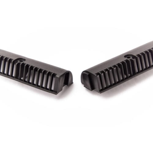 Close‑up of EasyTrim over‑fascia vents in black, showing slotted airflow design for eaves ventilation.